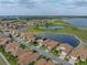 Scenic aerial view of a neighborhood with lake and golf course nearby at 4081 Dunmore Dr, Lake Wales, FL 33859