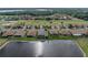 Aerial view of the home with a lovely pond at 4081 Dunmore Dr, Lake Wales, FL 33859