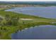 High angle showing a waterfront neighborhood with a nearby golf course at 4081 Dunmore Dr, Lake Wales, FL 33859