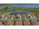 An aerial view of the home with lake and golf course views at 4081 Dunmore Dr, Lake Wales, FL 33859