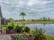 Scenic backyard featuring lush landscaping and tranquil lake views at 4081 Dunmore Dr, Lake Wales, FL 33859