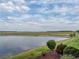 Scenic backyard view featuring a beautiful lake at 4081 Dunmore Dr, Lake Wales, FL 33859