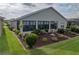 Well-maintained backyard with lush landscaping, mulch beds, and ample green space provides a serene outdoor setting at 4081 Dunmore Dr, Lake Wales, FL 33859