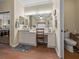 Bathroom with a vanity and makeup counter, cabinets, a large mirror, and good lighting at 4081 Dunmore Dr, Lake Wales, FL 33859