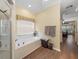 Bright bathroom with large tub, window, and a view into the bedroom at 4081 Dunmore Dr, Lake Wales, FL 33859