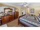 Spacious bedroom featuring wood floors, a large dresser, and a comfortable bed at 4081 Dunmore Dr, Lake Wales, FL 33859