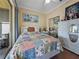 Comfortable bedroom with a view of the lanai through sliding glass doors and a closet with mirrored doors at 4081 Dunmore Dr, Lake Wales, FL 33859