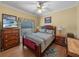 Bedroom featuring wood furniture, bed, dresser, and wood flooring at 4081 Dunmore Dr, Lake Wales, FL 33859