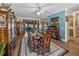 Formal dining room with a wood table, area rug, wood floors, large windows, and an elegant display cabinet at 4081 Dunmore Dr, Lake Wales, FL 33859