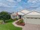 Attractive one-story home with a two-car garage, brick driveway, and meticulously maintained landscaping at 4081 Dunmore Dr, Lake Wales, FL 33859
