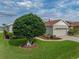 Attached two car garage with brick driveway, and well-maintained exterior at 4081 Dunmore Dr, Lake Wales, FL 33859