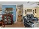 Hallway featuring hardwood floors and a display cabinet leading to the living room at 4081 Dunmore Dr, Lake Wales, FL 33859