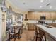 Eat-in kitchen with a breakfast nook, wood cabinets, white countertops, and hardwood floors at 4081 Dunmore Dr, Lake Wales, FL 33859
