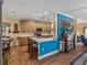 Eat-in kitchen with a breakfast bar, wood cabinets, and hardwood floors at 4081 Dunmore Dr, Lake Wales, FL 33859