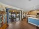 Bright kitchen featuring wood cabinets, marble countertops, stainless steel appliances, and views to a patio at 4081 Dunmore Dr, Lake Wales, FL 33859