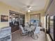 Enclosed lanai with comfortable seating, TV, and scenic views at 4081 Dunmore Dr, Lake Wales, FL 33859