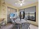 Enclosed lanai featuring a table and chairs, large windows, and water views at 4081 Dunmore Dr, Lake Wales, FL 33859