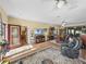 Spacious living room features hardwood floors, ceiling fans, an area rug and leather furniture at 4081 Dunmore Dr, Lake Wales, FL 33859