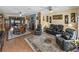 Spacious living room features hardwood floors, ceiling fans, an area rug and leather furniture at 4081 Dunmore Dr, Lake Wales, FL 33859