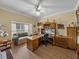 Home office features ample desk space, natural light, and ceiling fan at 4081 Dunmore Dr, Lake Wales, FL 33859