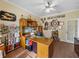 Well-organized home office with built-in shelving, a spacious desk, and ample natural light at 4081 Dunmore Dr, Lake Wales, FL 33859