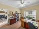 Well-lit home office with desk, storage, and comfortable seating near the window at 4081 Dunmore Dr, Lake Wales, FL 33859