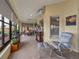 Inviting sunroom featuring tile floors, dining area, and comfortable seating with picturesque views of the surrounding landscape at 4081 Dunmore Dr, Lake Wales, FL 33859
