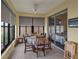 Charming sunroom with tiled flooring and a ceiling fan, perfect for relaxation with views of the outdoors at 4081 Dunmore Dr, Lake Wales, FL 33859