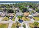 An aerial view shows the home and neighborhood, the roof, yard, and surrounding streets at 419 Broward Ter, Winter Haven, FL 33884