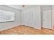Bright bedroom with closet, window, and light wood floor at 419 Broward Ter, Winter Haven, FL 33884