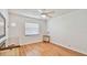 Bedroom featuring hardwood floors, a ceiling fan, and a window at 419 Broward Ter, Winter Haven, FL 33884