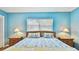 Light and bright bedroom with a large window and stylish bedding at 419 Broward Ter, Winter Haven, FL 33884