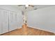 Bright bedroom with closet, window, and light wood floor at 419 Broward Ter, Winter Haven, FL 33884