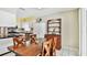 Kitchen and dining area with white tile floors and modern appliances at 419 Broward Ter, Winter Haven, FL 33884