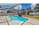 Sparkling screened-in pool with waterfall feature and ample deck space at 419 Broward Ter, Winter Haven, FL 33884