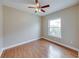 Cozy bedroom with wood-look floors and natural light from the window at 428 Terranova St, Winter Haven, FL 33884