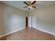 Comfortable bedroom features wood-look floors and a ceiling fan for added comfort at 428 Terranova St, Winter Haven, FL 33884