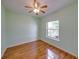 Inviting bedroom features wood-look floors, window for natural light and neutral color at 428 Terranova St, Winter Haven, FL 33884