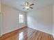Bright bedroom with wood-look floors and a window offering natural light and outdoor views at 428 Terranova St, Winter Haven, FL 33884