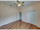 This bedroom has wood-look floors, closet and ceiling fan at 428 Terranova St, Winter Haven, FL 33884