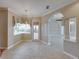 Bright dining area with tile floors, a decorative light fixture, and a view of the outdoor space at 428 Terranova St, Winter Haven, FL 33884