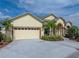 Charming home with a well-maintained front yard, a spacious driveway, and an attached garage, offering both curb appeal and convenience at 428 Terranova St, Winter Haven, FL 33884