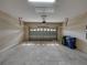 Spacious garage with an automatic door, high ceilings, and plenty of room for parking and storage at 428 Terranova St, Winter Haven, FL 33884