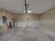 Large garage featuring an automatic door, water heater, electrical panel, and access door to the interior at 428 Terranova St, Winter Haven, FL 33884
