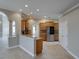Stylish eat-in kitchen features tile floors, granite counters, bar seating, and stainless steel appliances at 428 Terranova St, Winter Haven, FL 33884