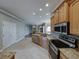 Open kitchen features granite countertops, stainless steel appliances, tile backsplash, and recessed lighting at 428 Terranova St, Winter Haven, FL 33884