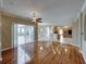 Open floor plan showcasing the hardwood floors and view to the outdoor living and the open kitchen at 428 Terranova St, Winter Haven, FL 33884