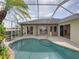 Screened pool with steps, palm tree, and access to the home's multiple entry points offers an inviting outdoor experience at 428 Terranova St, Winter Haven, FL 33884