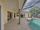 Screened in pool featuring tile floors, and an outdoor lounge area at 428 Terranova St, Winter Haven, FL 33884