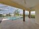 Screened in lanai featuring a pool, tile flooring, and exterior views at 428 Terranova St, Winter Haven, FL 33884